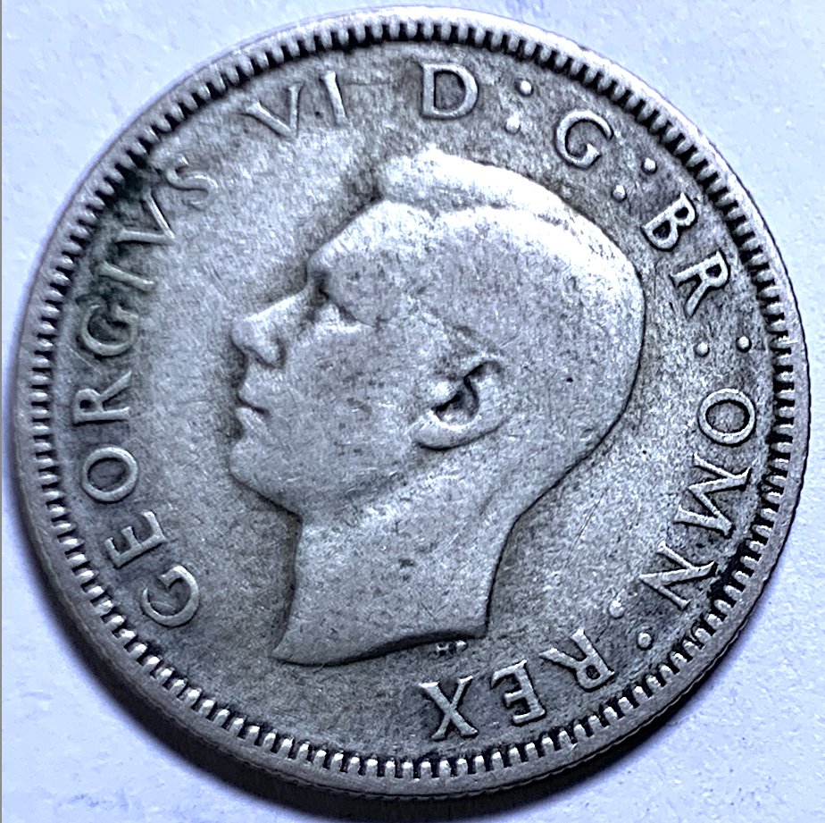 Un chelín británico de 1937 – Emisión del primer año – Jorge VI – KM#851a – 0,500 Plata